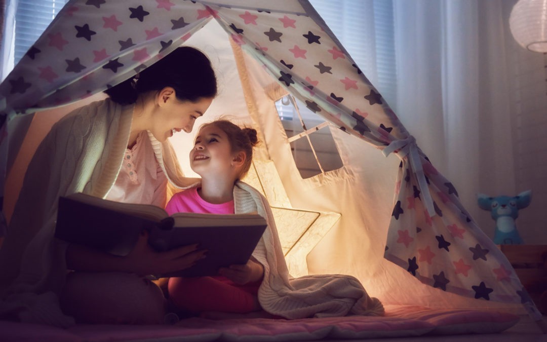 Mom-and-daughter-reading-story-in-tent-1080x675